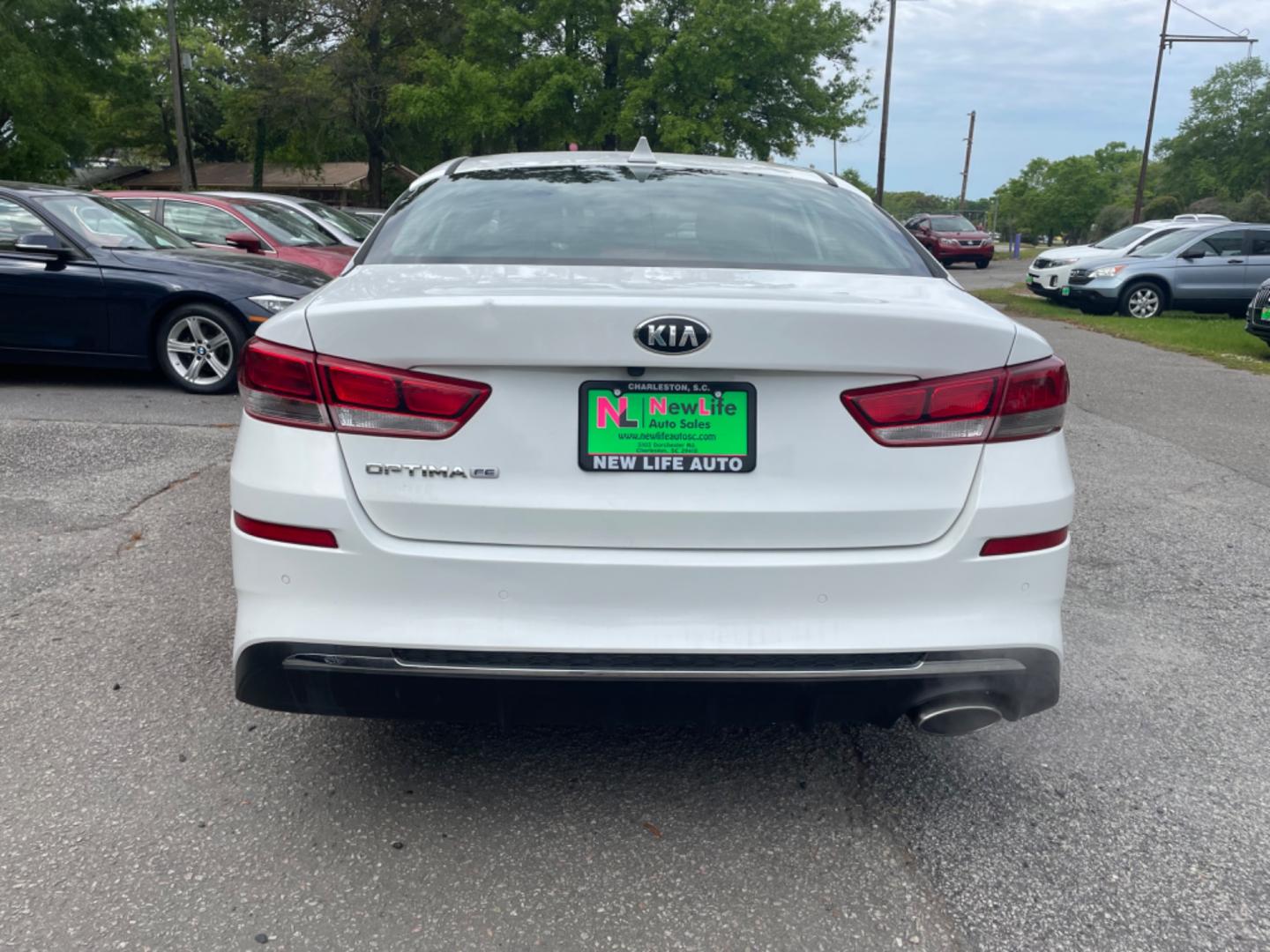 2019 WHITE KIA OPTIMA LX (5XXGT4L38KG) with an 2.4L engine, Automatic transmission, located at 5103 Dorchester Rd., Charleston, SC, 29418-5607, (843) 767-1122, 36.245171, -115.228050 - Spacious interior with AUX/USB/Bluetooth, Backup Camera, Power Windows, Power Locks, Power Mirrors, Keyless Entry, Alloy Wheels. Local Trade-in! 124k miles Located at New Life Auto Sales! 2023 WINNER for Post & Courier's Charleston's Choice Pre-owned Car Dealer AND 2018-2024 Top 5 Finalist for Char - Photo#5